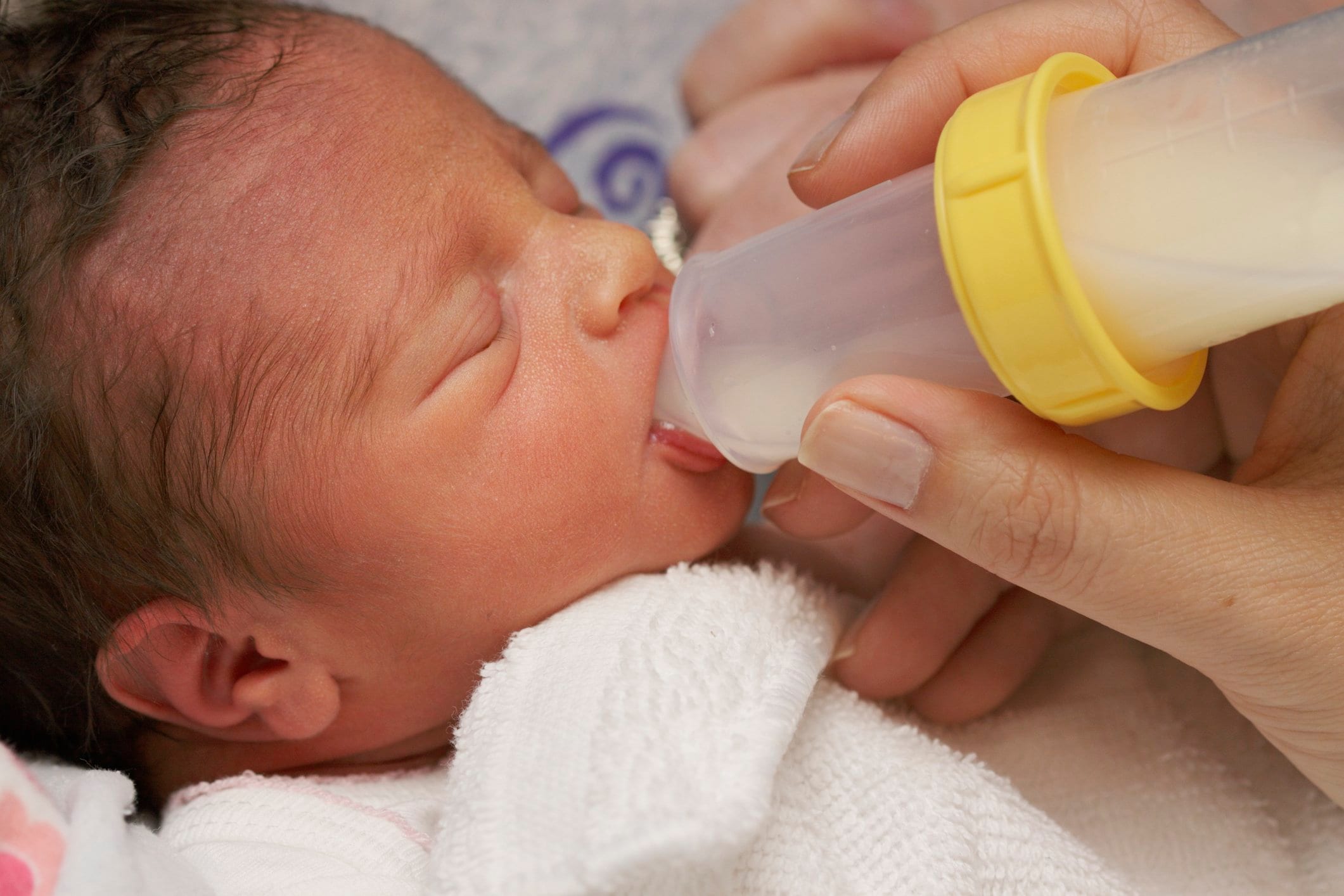 Photo of baby drink from bottle