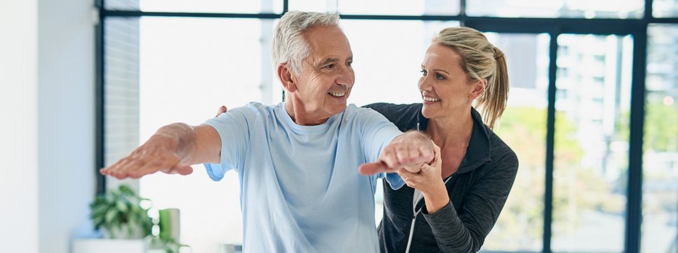 Image of physical therapist working with patient 