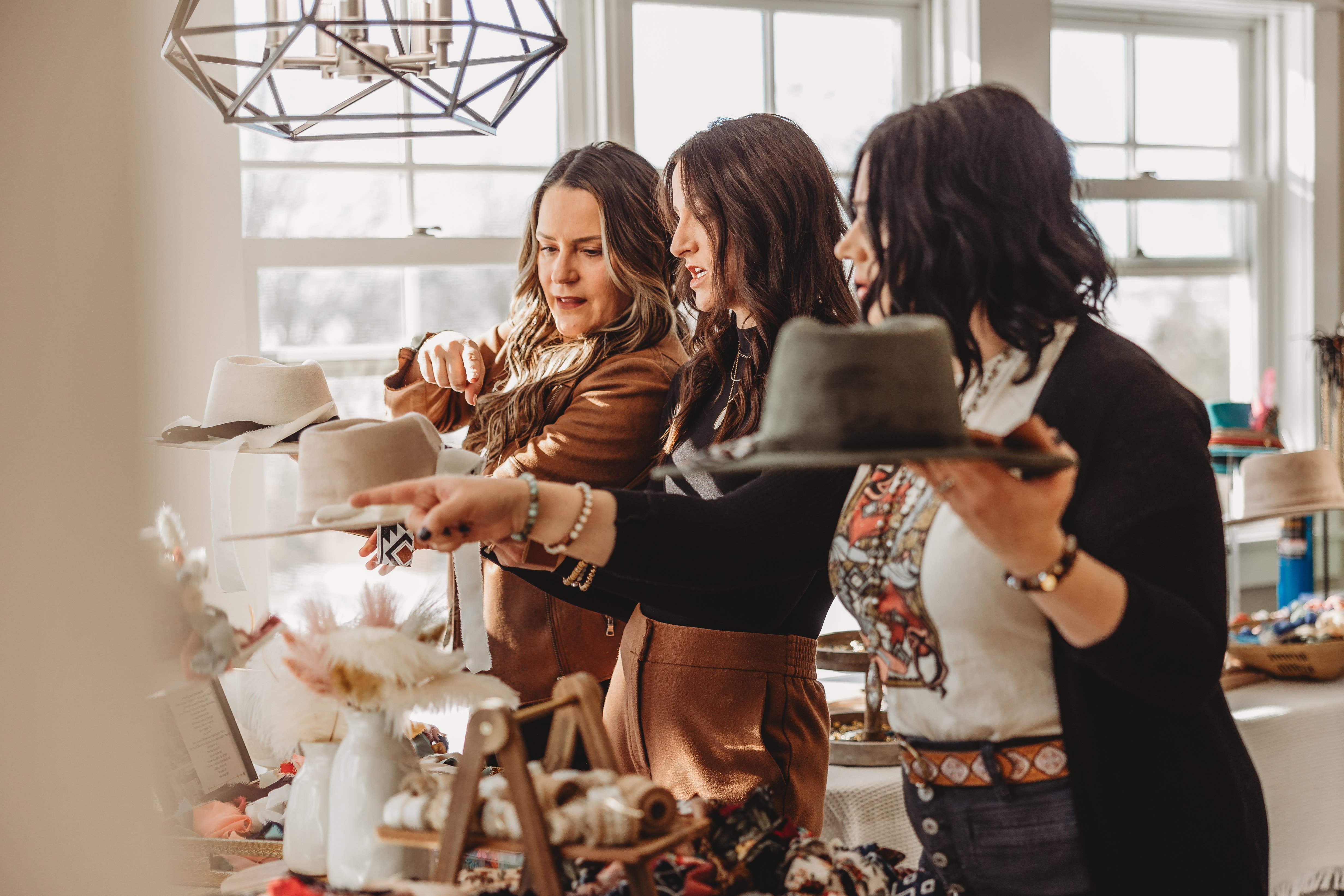 Photo of women looking at hats