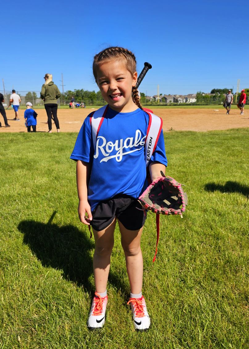 Photo of Dorothy in softball uniform